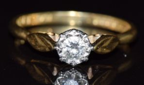 An 18ct gold ring set with a diamond of approximately 0.18ct in a platinum illusion setting, 2.9g,