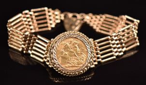 A 9ct gold gate bracelet set with a 1909 gold full sovereign, 23.8g