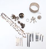 A silver bangle, silver button, Mexican silver brooch, earrings, etc