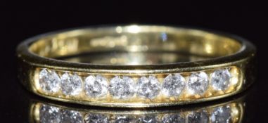 An 18ct gold half eternity ring set with eight diamonds totalling approximately 0.33ct, 2.6g, size