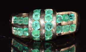A 9ct gold ring set with round cut emeralds, 3.3g, size N