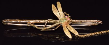 A 9ct gold dragonfly brooch set with an oval cut aquamarine and paste eyes, 4.8g, 6.5cm
