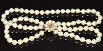 A double strand cultured pearl necklace, the 9ct gold clasp set with a diamond and pearls, 57.6g