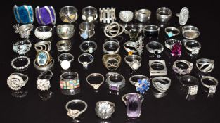 Fifty silver rings including opal, amethyst, topaz, garnet, abalone, etc