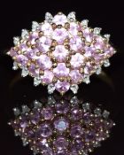 A 9ct gold ring set with pink sapphires and diamonds, 2.7g, size N