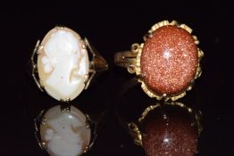 Two 9ct gold rings, one set with a sunstone cabochon the other a cameo, 6.3g, sizes N & J