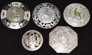 Four Peruvian silver brooches and a Peruana silver coin converted to a brooch