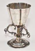 Victorian hallmarked silver cup with triple support below, import marks for London 1889, maker David