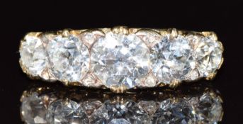 An 18ct gold ring set with five diamonds of approximately 1.2ct, 0.68ct, 0.7ct, 0.3ct & 0.3ct with