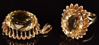 A 9ct gold ring set with an oval cut citrine and a matching pendant, 20.2g