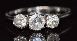 A c1915 platinum / 18ct white gold ring set with three diamonds, the largest approximately 0.28ct,