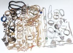 A collection of jewellery including spider, lizard and leopard brooches, serpent bangles and