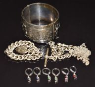 A silver bangle, silver watch chain / curb link bracelet, silver earrings, etc