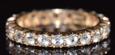 A 9ct gold eternity ring set with spinel, 2.5g, size J