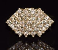 A 9ct gold ring set with champagne/cognac diamonds in a cluster, 5.7g, size R