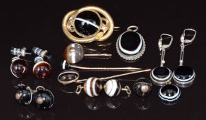 A collection of Victorian banded agate including earrings, stick pins, pendants and brooch