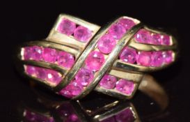 A 9ct gold ring set with round cut rubies, 3g, size N