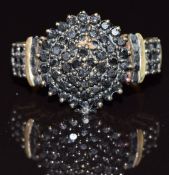 A 9ct gold ring set with approximately 1ct of black diamonds in a cluster, 4.1g, size K