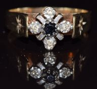 A 9ct gold ring set with a sapphire and diamonds, 3.7g, size O