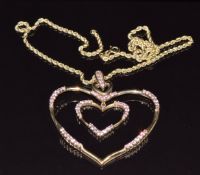 A 9k gold pendant set with pink sapphires on 9ct gold rope twist necklace, 10g, 40cm long