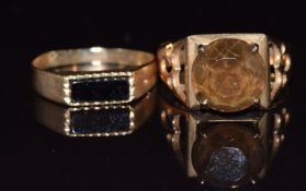 A 9ct gold ring set with a quartz and a 9ct gold ring set with onyx, 4.4g, sizes N & M