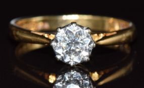 An 18ct gold ring set with a diamond in an illusion setting, 2.7g, size L