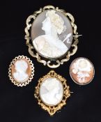 Victorian brooch set with a cameo depicting a classical woman with grapes to her hair and ram's head