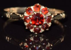 A 9ct gold ring set with garnets in a cluster, 1.9g, size P
