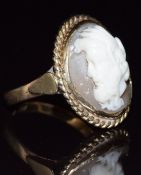 A 22ct gold ring set with a cameo depicting a man, in a 9ct gold surround, 8.3g, size R