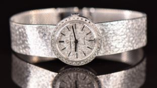 Eterna-Matic Sahida 18ct gold ladies automatic wristwatch with diamond inset bezel, blued hands,