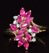 A 9ct gold ring set with marquise cut rubies and diamonds, 2.6g, size N