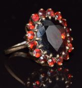 A 9ct gold ring set with a cluster of garnets, 5.5g, size J/K