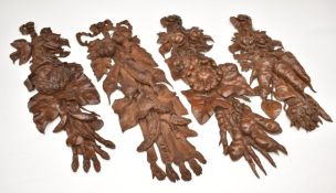 Set of four Grinling Gibbons or similar wooden carvings of vegetables with bows to top, length 51cm