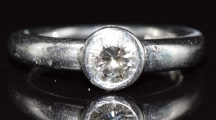 A platinum ring set with a round brilliant cut diamond of approximately 0.5ct, 7.8g, size J