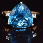 A 9ct gold ring set with a London blue topaz and diamonds, 3.8g, size S
