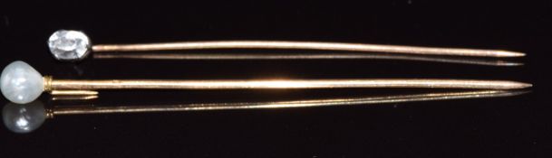 French 18ct gold stick pin set with a natural pearl (7.6cm) and a 9ct gold stick pin set with a