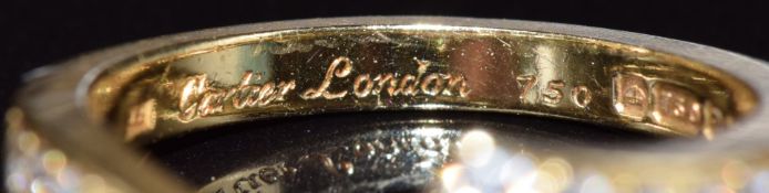 Cartier London bespoke 18ct gold ring of stylised V shape to fit next to an engagement ring, set