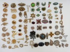 A collection of vintage brooches including Sphinx, Toledo, Coro Craft, Movitex, etc