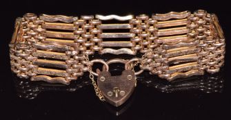A c1900 9ct rose gold gate bracelet with textured decoration, 23.1g, 18.5cm