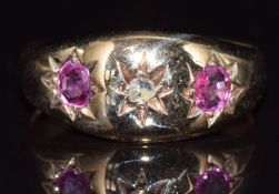 Edwardian 9ct gold ring set with a diamond and two rubies in a star setting, 3.7g, size N