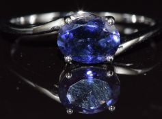 A 9ct white gold ring set with an oval cut tanzanite, 1.8g, size S