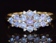A 9ct gold ring set with tanzanites and diamonds, 2.4g, size P