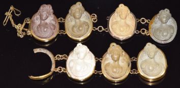 A yellow metal c1900 bracelet set with seven lava cameos 16cm