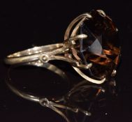 A 9ct gold ring set with an octagonal smoky quartz, 8.5g, size N