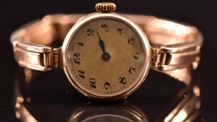 Unnamed 9ct gold ladies wristwatch with blued hands, Arabic numerals, silver dial and unsigned