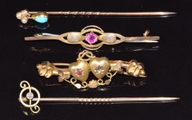 A 15ct gold stick pin set with a diamond, a 9ct gold stick pin set with seed pearls and turquoise