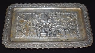 Indian or Burmese silver tray, with embossed decoration of buildings, trees and a figure, length