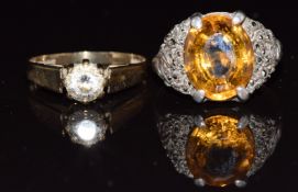 A 9ct gold ring set with cubic zirconia (1.8g, size L) and a 9ct gold and silver ring set with a