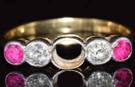 An 18ct gold ring set with two old cut diamonds and two rubies, the largest diamond  approximately