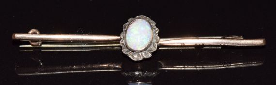 A 9ct gold bar brooch set with an opal cabochon, 2.8g